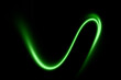 © Idee khan - Abstract glowing green light trail on black background