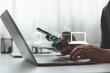 © MUNTHITA - Cloud sync technology concept. Person use smartphone and laptop for data synchronization notification system secure file transfer communication integration and real time digital connection workflow.