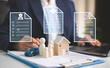 © Custard Pixel - Insurance contracts with businessperson reviewing family house and car protection plans representing bundled coverage risk management financial security policy comparison and future planning.