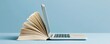 © oksa_studio - Education and technology merging as an open book and laptop screen for digital learning research and school study