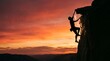 © Rahmat Chowdhury  - Rock climber scaling a steep cliff face during a vibrant sunset
