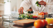 © peopleimages.com - Person, hands and meal prep with food container in kitchen for healthy detox or ready made snack. Culinary artist, chef or vegetables with ingredients for diet, wellness or eating plan in home