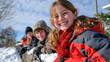 © Maksym Tereshchenko - Low angle view looking up at children's faces as they peer over a snow-covered fence at a snowman they built near the school path, hats and scarves in view, a joyful winter childhood moment set agai