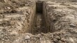 © Variety Visuals - Deep trench excavation with vertical soil walls at a construction site.