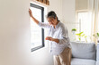 © Pormezz - Aged woman feel dizzy and headache at home.