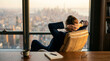 © MD ISTIAQUE ABEDIN - Successful businessman executive relaxing in luxurious high rise office contemplating cityscape view from large window overlooking urban skyline thoughtful confident professional at desk