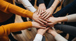 © PhotoArtHub - Pile of hands in stacked formation, signifying unity, teamwork, and collaboration, representing shared effort and collective spirit for any project