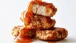 © PinkiePie - Golden fried pork nuggets, sweet and sour sauce dripping, clean studio white background, copy space