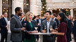© Unicraft - Diverse business professionals networking and socializing at an outdoor evening cocktail event