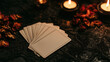 © Billy - Blank tarot cards fanned out on dark lace table with burning candles and dried roses. Mystic fortune telling scene with copy space on empty cards.
