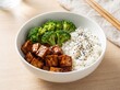 © Nazma Akter  - Healthy rice bowl with grilled tofu broccoli and black sesame seeds in a ceramic dish broccoli vegetarian japanese nutrition culinary homemade delicious
