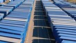 © Generative AI - Aerial view of blue shipping containers in storage