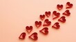 © Ema - Red paper quilling hearts on a soft pink background