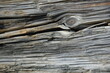 © Михаил Кривовяз - Close-up of aged weathered wooden planks with cracked, peeling, and rough natural grain. Gray and brown tones create a rustic, distressed surface texture suitable for backgrounds, vintage designs, con
