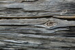 © Михаил Кривовяз - Close-up of aged weathered wooden planks with cracked, peeling, and rough natural grain. Gray and brown tones create a rustic, distressed surface texture suitable for backgrounds, vintage designs, con