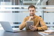 © Liubomir - Digital transformation and business strategy, professional man using tablet and laptop for corporate planning in modern office. Executive manager analyzing data and developing innovation for business.