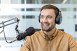 © Liubomir - Podcast host recording audio content.