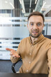 © Liubomir - Video conference call with professional man, remote work communication and virtual meeting concept in modern office. Businessman talking to camera during online business discussion.