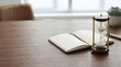 © gmstockstudio - Hourglass and notepad at home