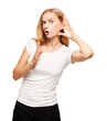 © Tatyana Gladskih - Surprised young woman listening with hand near ear and holding palm up. Blonde girl in white t-shirt eavesdropping on gossip isolated on white background.