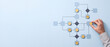 © Mas.Deni - Hand organizing complex business workflow diagram with yellow markers on blue background, depicting process optimization and strategic planning logic.