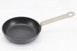 © Fikri - Compact black frying pan with a natural wood handle, shown at an angle against a white background for product-focused cookware photography.