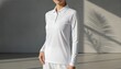 © QuoDesign - Young woman wearing a blank white long sleeve polo shirt at a sunlit tennis club