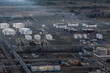© Турар Казангапов - Large oil refinery complex with storage tanks and industrial infrastructure in Pavlodar, Kazakhstan.