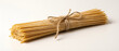 © Yuliia - Bundle of dried spaghetti pasta tied with twine