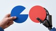 © Generative AI - Human and robot hand holding blue and red