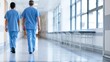© Generative AI - Two medical professionals walking away down a hospital