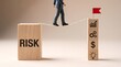 © Oliur - Navigating business challenges a person carefully steps from a 'risk' block towards a tower representing growth and financial opportunity