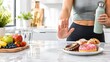 © Sumiya - Healthy Diet and Fitness Concept Woman Rejecting Junk Food Sweets and Donuts