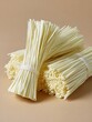 © Volodymyr Hankevych - Dry asian vermicelli noodles bundle, Raw food ingredient texture, Culinary healthy cooking element
