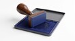© Felippe Lopes - Wooden handle rubber stamp being inked in a blue ink pad with a grey lid on a white background
