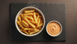 © Ace - Golden crispy french fries served in a bowl with dipping sauce on dark slate perfect for delicious fast food advertising and savory snack menus