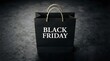 © MST.ANTOR MONI AKTER - Black shopping bag with black friday text on a dark textured background