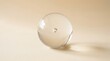 © Musa - Clear glass sphere with a small bubble inside on a light beige background, transparent