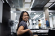 © ReeldealHD images - Young Woman Smiling While Working in a Modern Office