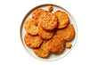 © Adrita - Delicious golden fried Bengali taler pitha on white plate, top view, isolated background