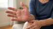 © sorin - Middle Aged Woman Experiencing Hand Pain Due To Arthritis While Consulting In Clinical Office