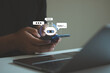 © MUNTHITA - Person chatting with digital assistant chatbot on mobile phone application, Future of customer service man utilizes AI chatbot for instant assistance. AI Artificial Intelligence, Digital chat bot.