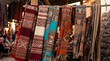 © Salman - Colorful patterned textiles hanging in outdoor market