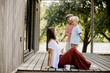 © BGStock72 - Joyful family moments by the riverside in a cozy outdoor setting