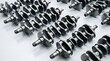 © Business Life - Multiple steel engine crankshafts arranged on a workshop floor ready for automotive assembly