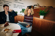© Júlia Amaral - Young business people from gen Z working in cafe