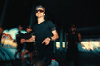 © Jacob Lund - Male runner leads night run club session with energetic outdoor pace