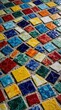 © miss irine - Colorful square and rectangular mosaic tiles lie on grey concrete surface. Many pieces are broken showing intricate craquelure patterns. Tiles are arranged in neat rows and columns.