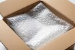 © miss irine - Open cardboard box with bubble wrap inside, ready for shipping fragile items. Secure packaging protects goods during transit and storage. Safe parcel for delivery.