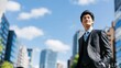 © The Little Hut - Confident Asian Businessman in Suit Walking Through Modern City Streets Under Blue Sky